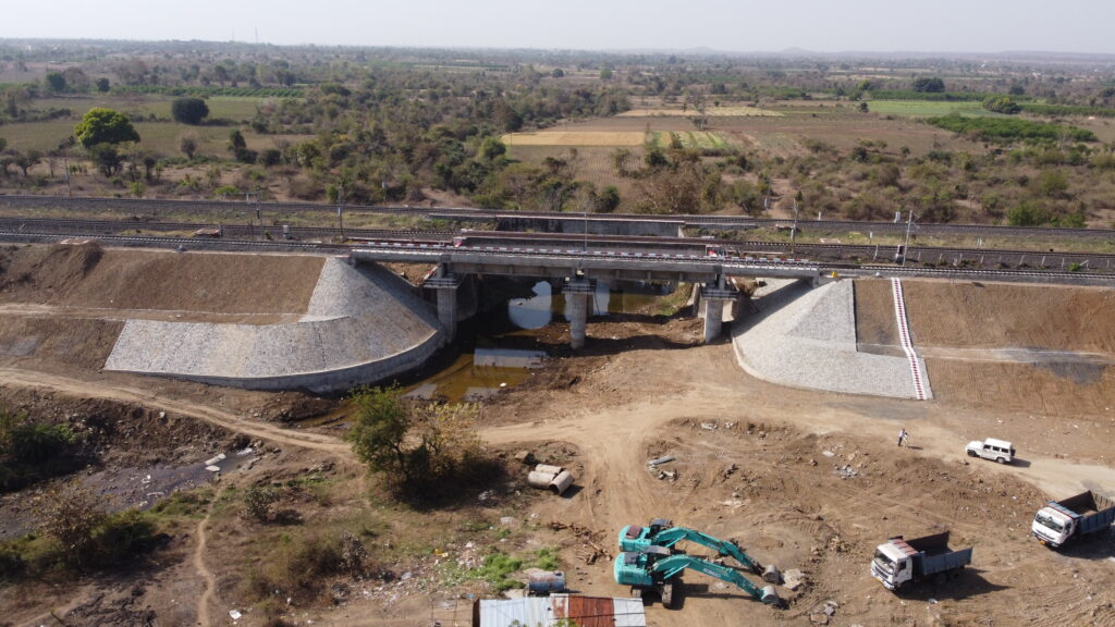 Industrial photoshoot of Chandrabhaga Railway Bridge showcasing its construction site and landscape.